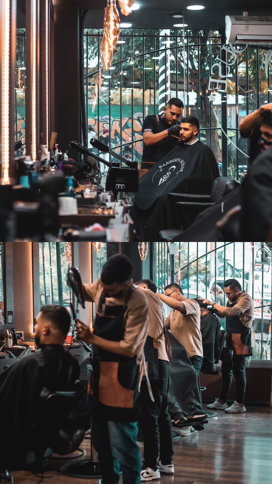 Un barbero perfilando la barba de un cliente junto al ventanal